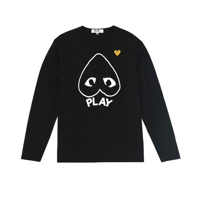Sweatshirt CDG homme avec logo cœur jaune, style streetwear moderne et minimaliste.